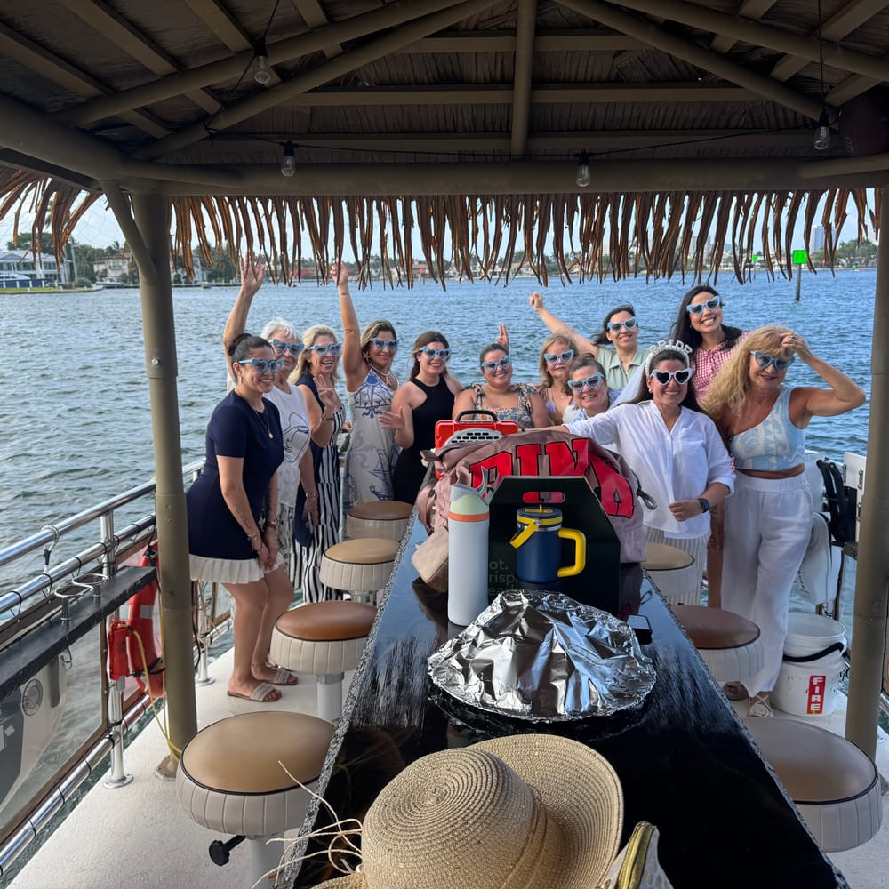 Group celebrating on board a Tiki Taco cruise