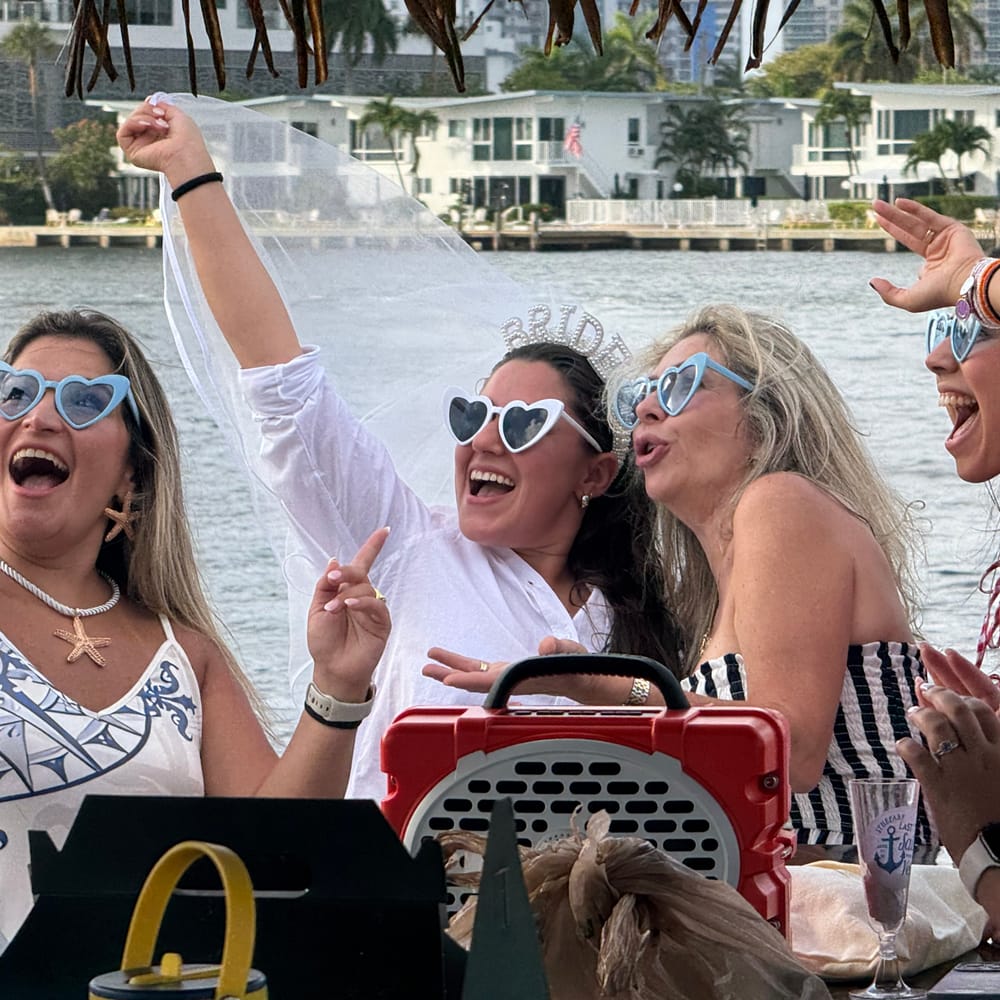 Friends celebrating on the water in Fort Lauderdale